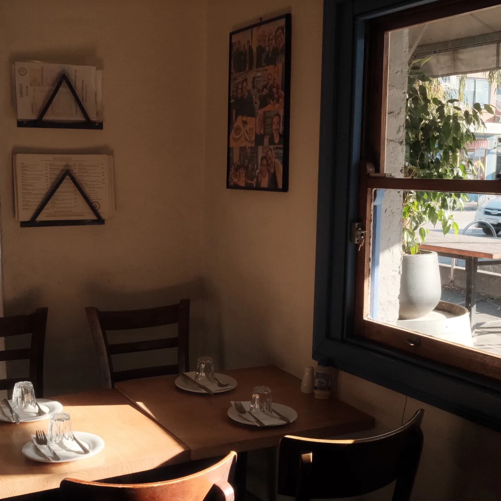 Sunlit table by the window at Alpha Ouzeri